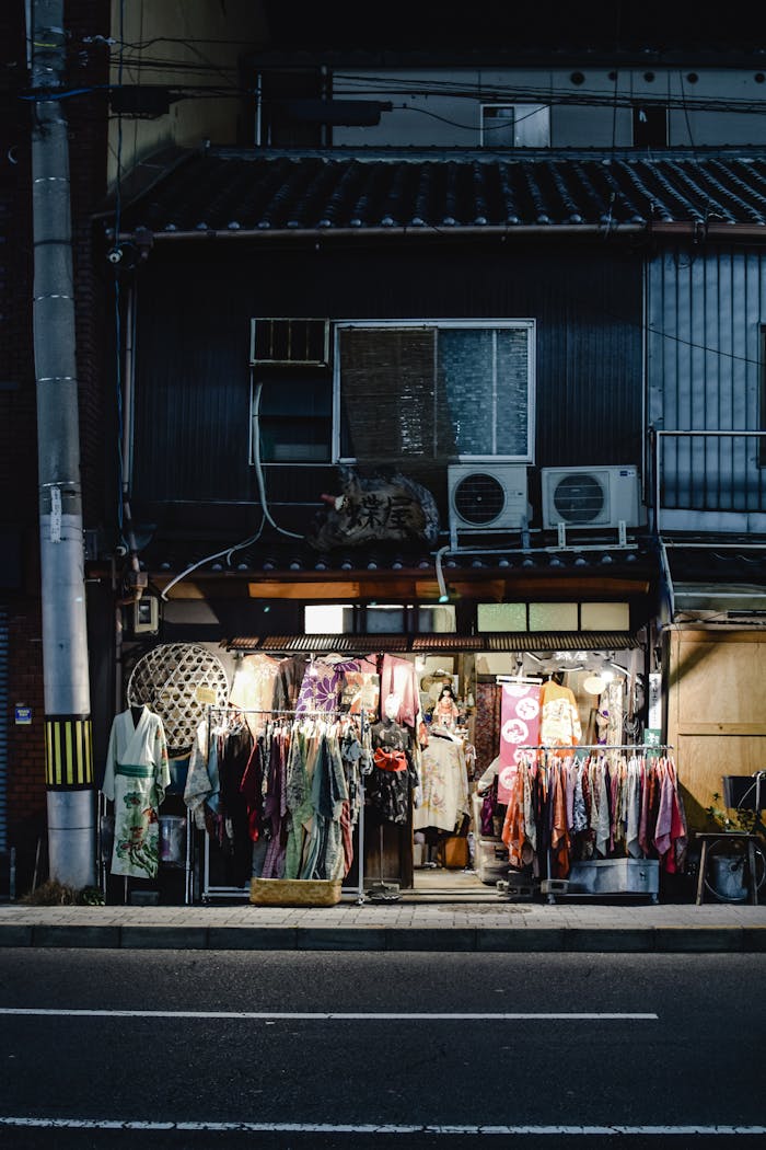 Charming street view of traditional kimono shop in Kyoto at night.